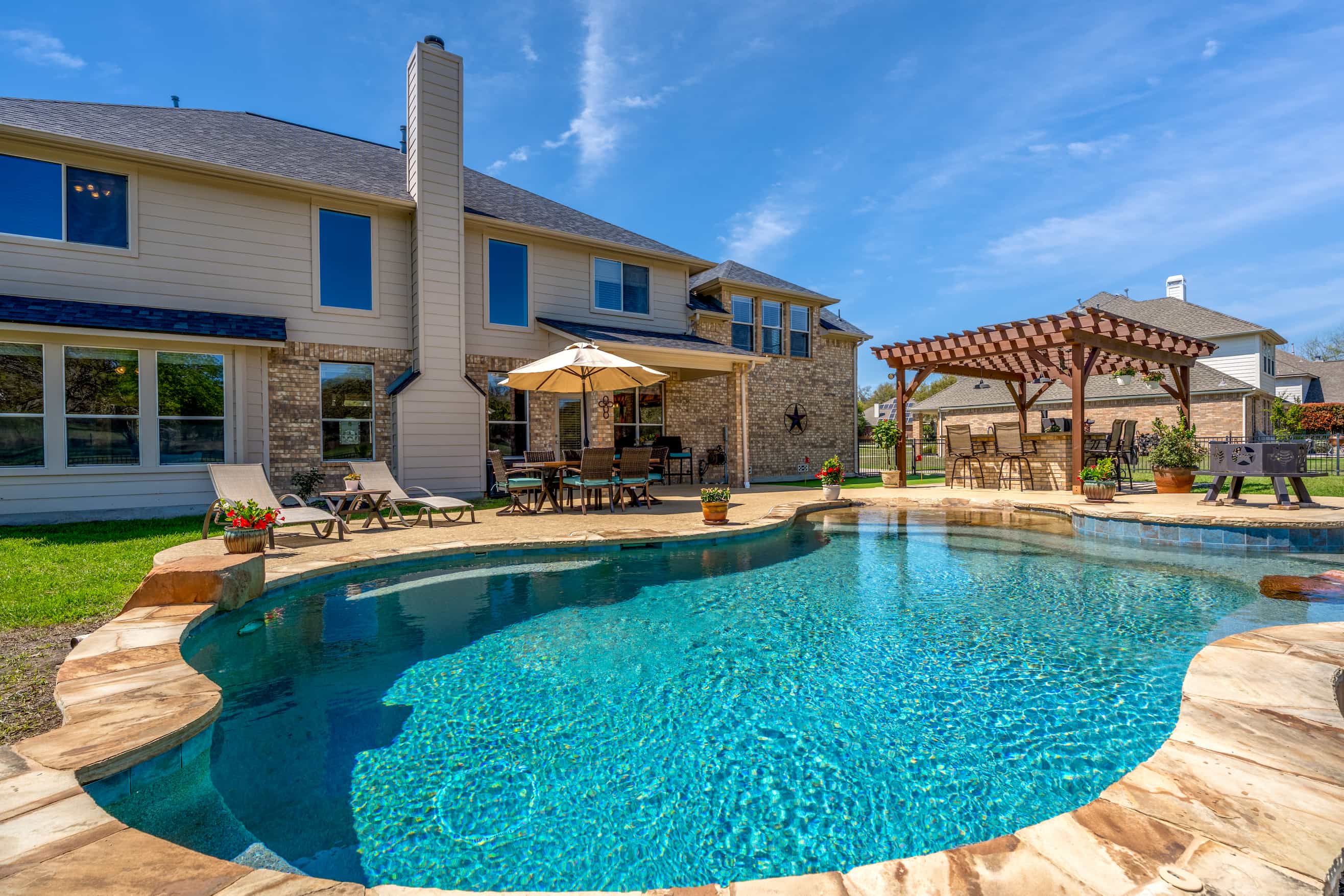 Custom pool and outdoor living project in San Antonio at twilight