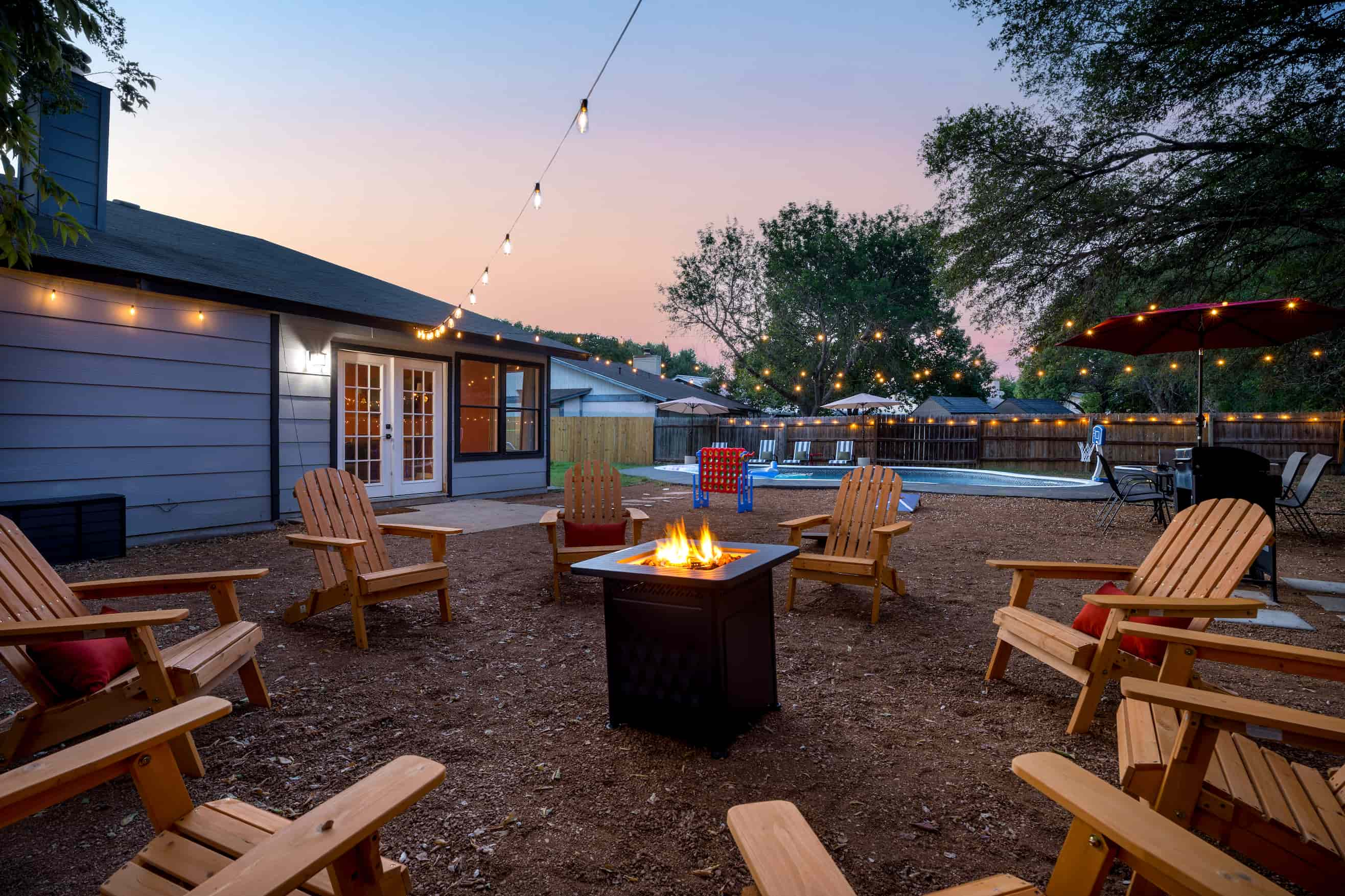 San Antonio short-term rental with backyard pool at dusk